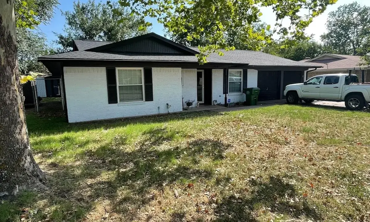 Professional roofing crew working on a residential roof in Show Low
